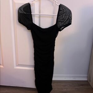 Elegant Black Dress with Sheer Sleeves